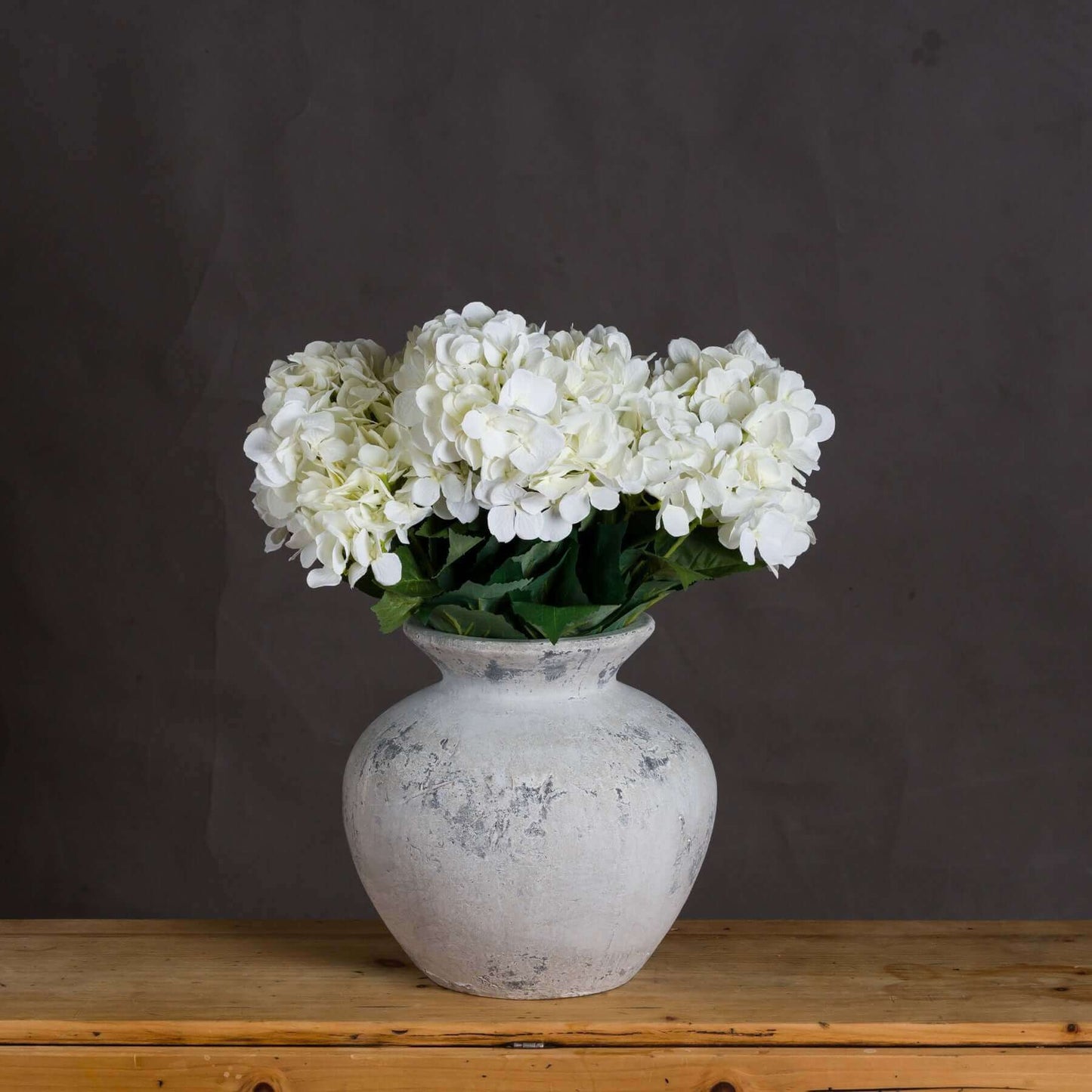 Darcy Antique White Vase | Description Introducing the Darcy Antique White Vase - the perfect addition to your home decor. Display your favorite flowers or greenery in this timeless and unique Greek-inspired vase. With a beautiful white finish, this vase