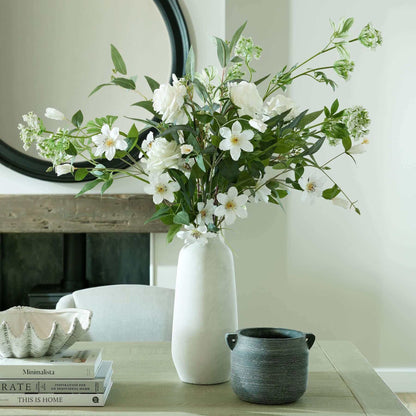 Darcy Tall Ople Vase | Description The Darcy Ople Vase boasts a modern shape and classic color, making it a perfect fit for both minimalist and country chic homes. Its natural stone finish adds texture, while the slim neck allows for a stylish display of