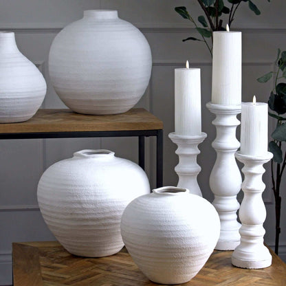 Regola Large Matt White Ceramic Vase | Description This sleek and modern Regola Large Matt White Ceramic Vase is the perfect addition to any home. Its versatile design allows for the display of both faux and real flowers, making it a practical and stylish