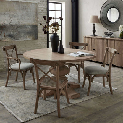 Copgrove Pedestal Dining Table | Description Enter the perfect setting for memorable gatherings for 4-6 guests with the Copgrove Pedestal Dining Table. This French-style round table is hand-crafted from hardwood and finished with a washed bleach look to c