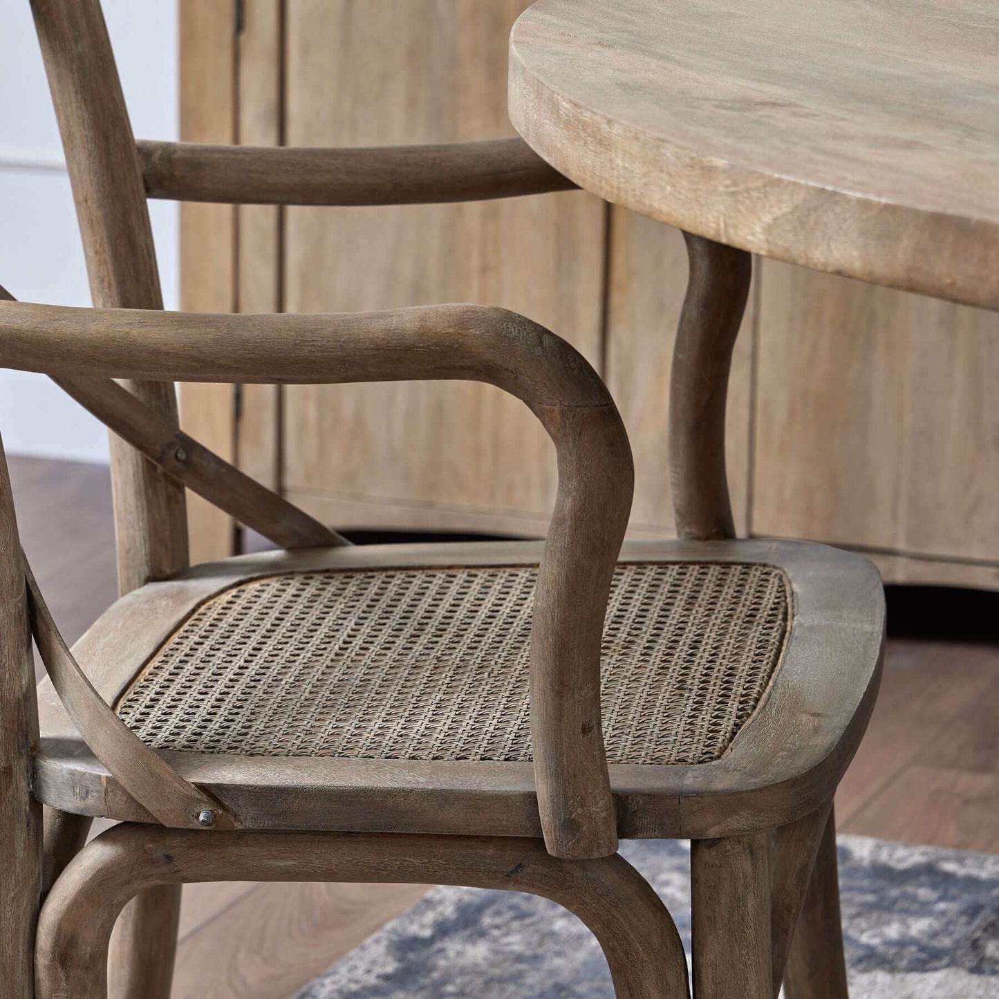 Cross Back Carver Dining Chair | Description Our Cross Back Carver Dining Chair is made of solid wood, with a brown rush seat and a cross back design. Its sturdy frame ensures durability and makes it ideal for any dining area. Product Specification Length