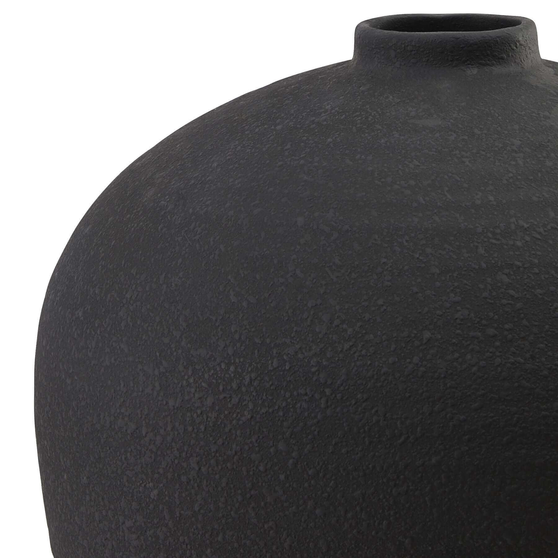 Matt Black Tall Astral Vase | Description The Matt Black Tall Astral Vase is a sleek and modern addition to any home. Its large size allows for versatile styling options, whether standing on the floor or paired with a smaller vase for a dynamic display. I