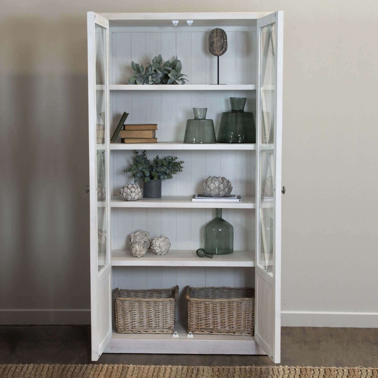 Stamford Cabinet | Description Experience the effortless charm and timeless design of Stamford Cabinet. Its airy, lattice patterned, tempered glass doors add a touch of relaxed elegance to any space. This handmade, planked pine cabinet boasts a familiar,