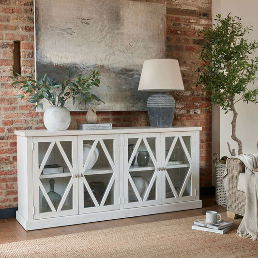 Stamford 4 Door Sideboard | Description The Stamford 4 Door Sideboard is ideal for spaces with a laid-back atmosphere. Its lattice-patterned, tempered glass doors instantly add a sense of lightness to any room. With a timeless, rustic charm and a distress