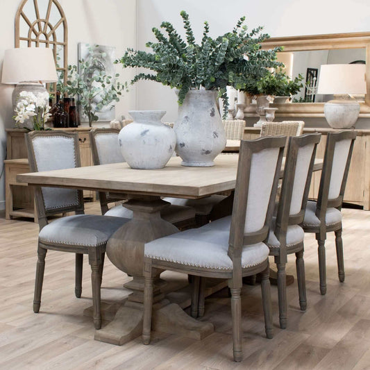 Copgrove Large Dining Table | Description The Copgrove Dining Table is the perfect centerpiece for hosting friends and family. Hand-crafted from hardwood and finished with a washed bleach hue, it’s a timeless and luxurious addition to any dining space. Se