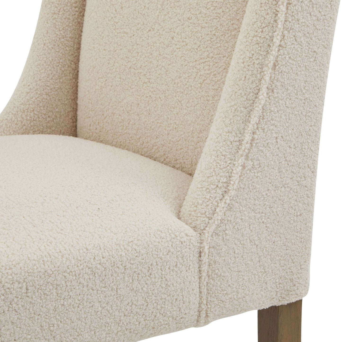 Compton Boucle Dining Chair | Description Introducing the Compton Boucle Dining Chair - a perfect blend of style and functionality. Crafted with a sturdy rubberwood frame, it offers strength and durability for everyday use. The cream boucle upholstery and