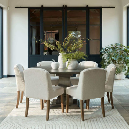 Compton Boucle Dining Chair | Description Introducing the Compton Boucle Dining Chair - a perfect blend of style and functionality. Crafted with a sturdy rubberwood frame, it offers strength and durability for everyday use. The cream boucle upholstery and