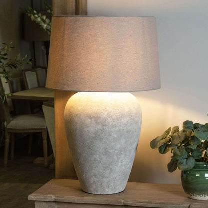 Athena Stone Table Lamp | Illuminate Your Space with Timeless Elegance: Athena Stone Table Lamp Description The Athena Stone Table Lamp is a perfect blend of classic design and modern functionality. Made from high-quality ceramic, this lamp features an ag