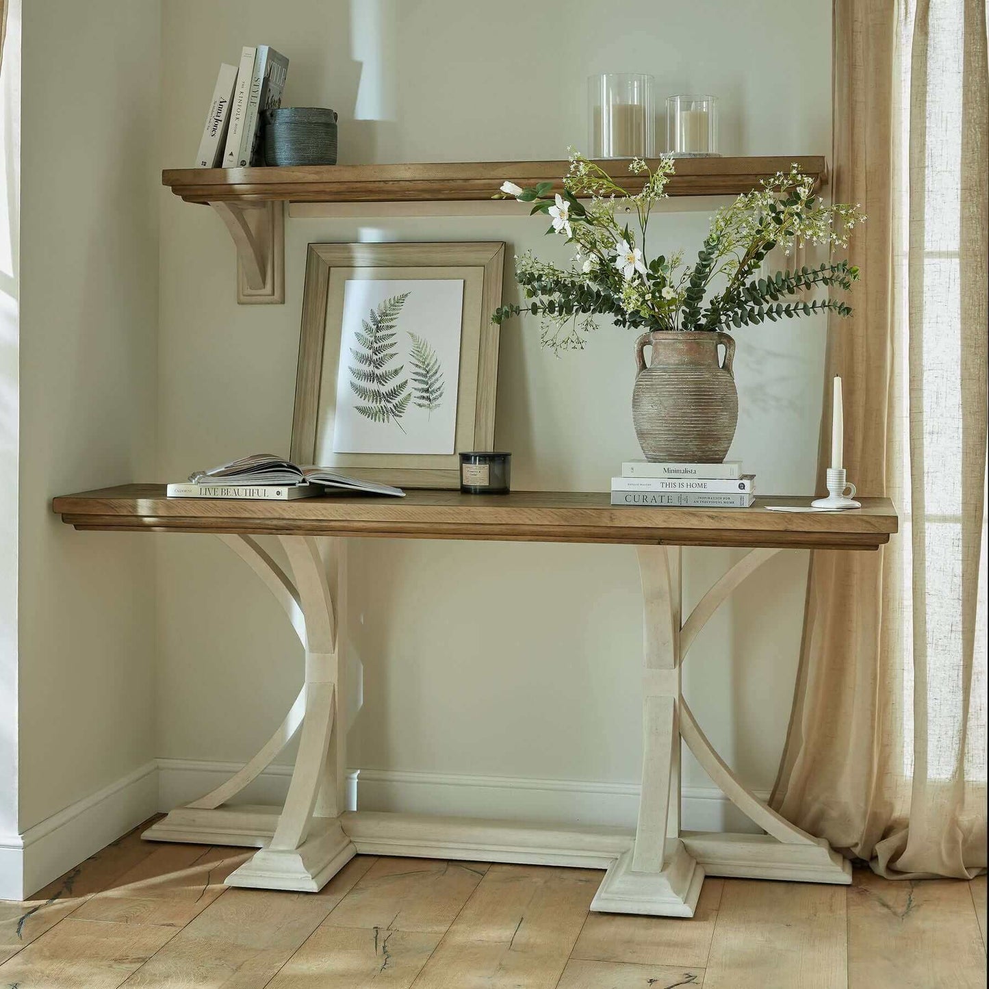 Luna Console Table | Description The Luna Console Table effortlessly blends timeless appeal with modern sophistication, making it the perfect centerpiece for any hallway, dining room, or living room. Its sleek silhouette and off-white painted bottom add a