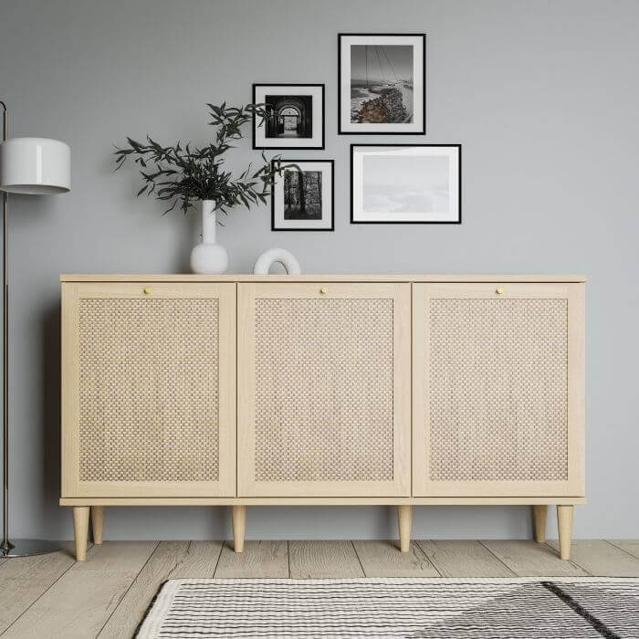 Calasetta 3 Door Sideboard in Rattan | Description The Calasetta Sideboard is a beautifully crafted furniture set, showcasing a mesmerizing rattan-like appearance. Its versatile design makes it a perfect addition to any living or dining space, seamlessly