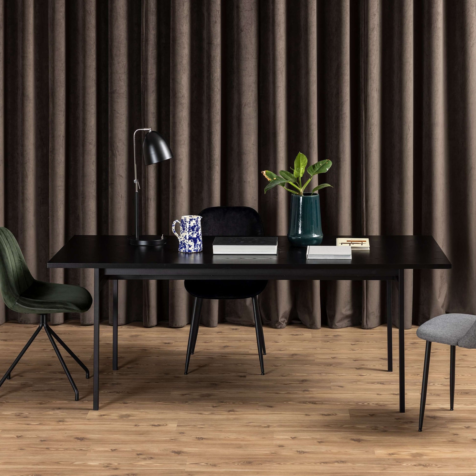 Angus Black Dining Table | Angus Black Dining Table - Modern, Sleek, and Stylish Description The Angus Black Dining Table brings a cool, modern touch to any living space with its sleek lines and lightweight construction. Supported by powder-coated metal l