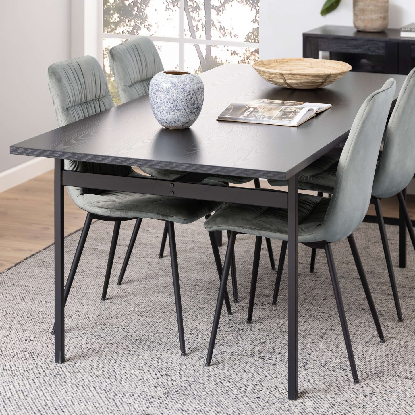 Angus Black Dining Table | Angus Black Dining Table - Modern, Sleek, and Stylish Description The Angus Black Dining Table brings a cool, modern touch to any living space with its sleek lines and lightweight construction. Supported by powder-coated metal l