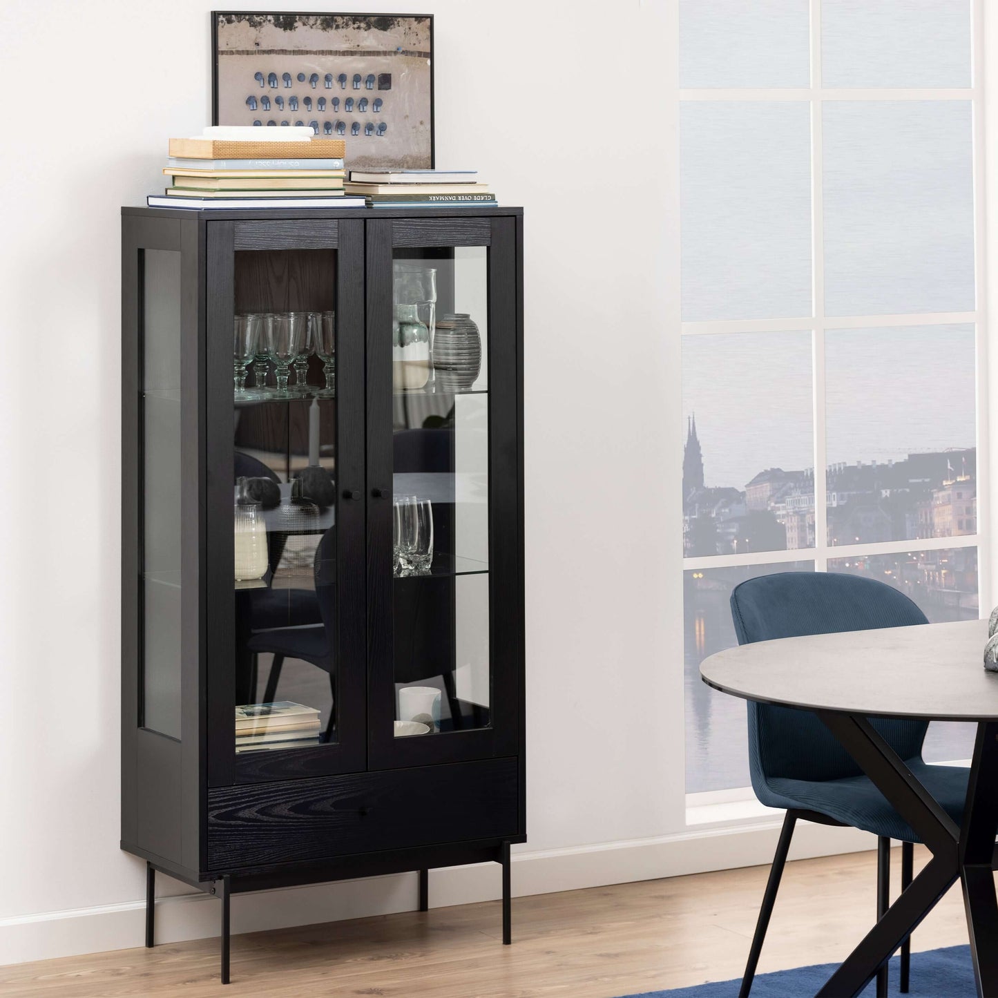 Angus Black Display Cabinet | Elevate Your Home Décor with the Angus Black Display Cabinet Description The Angus Black Display Cabinet combines sleek lines with an airy design to make a contemporary statement in any home. Perfect for showcasing your favor