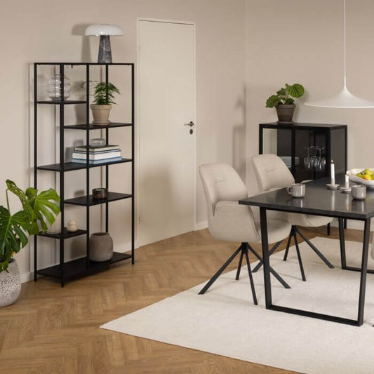 Modern living room with Newcastle Wall Unit, sleek black frame, and asymmetrical shelves for stylish storage and décor.