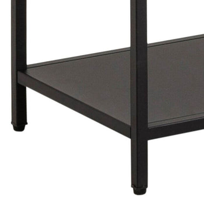 Close-up of Newcastle Wall Unit's black asymmetrical shelf and leg