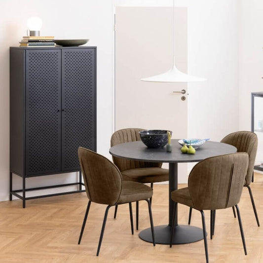 Newcastle 2 Door Cabinet in a modern dining room with green chairs and a round table.